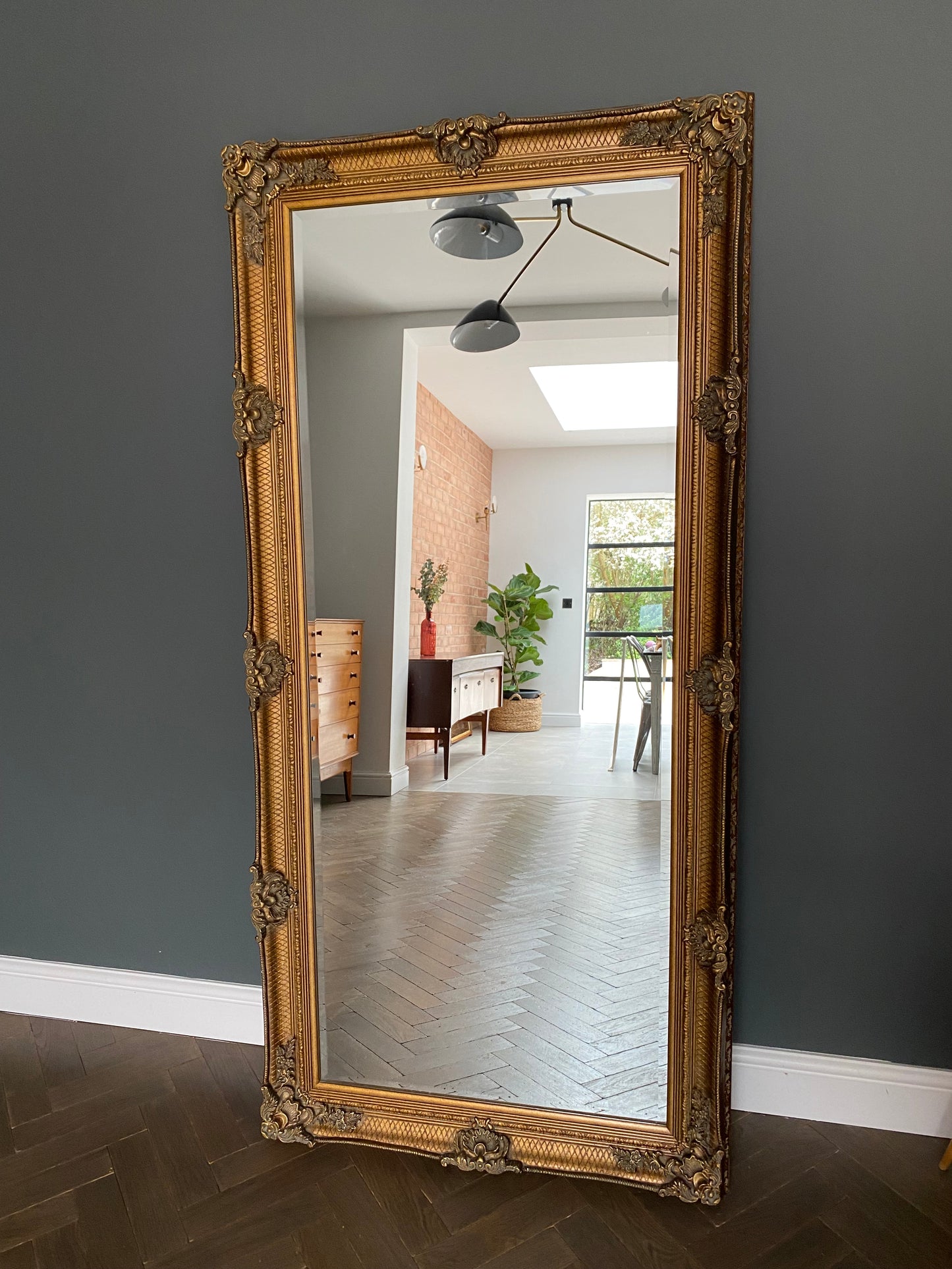 Large ornate gold portrait mirror