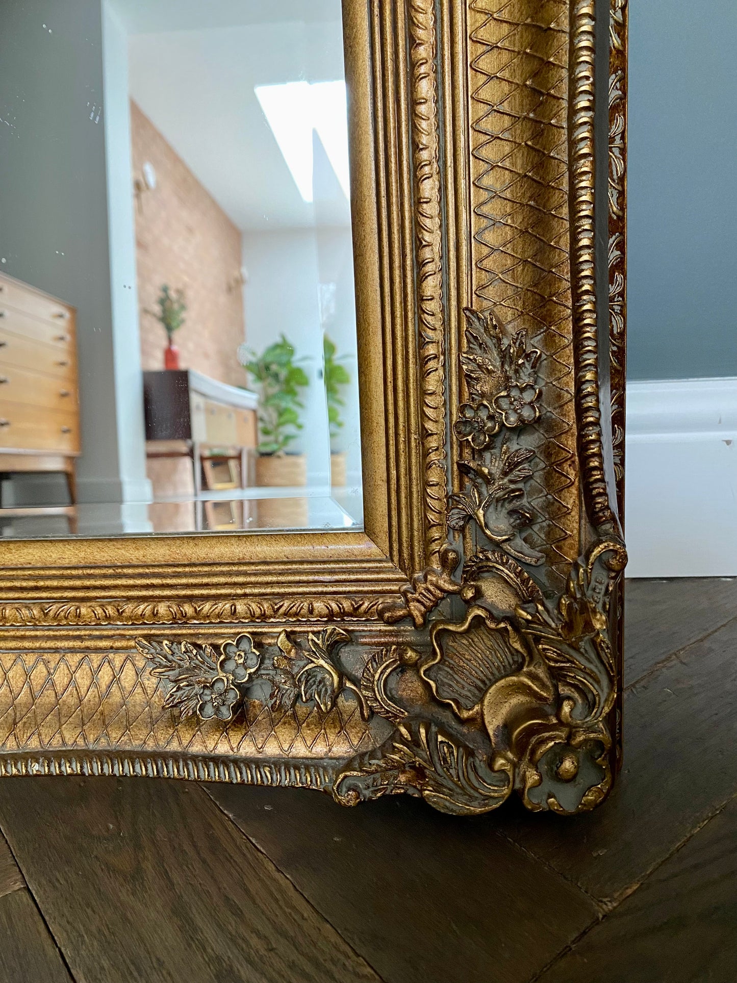 Large ornate gold portrait mirror