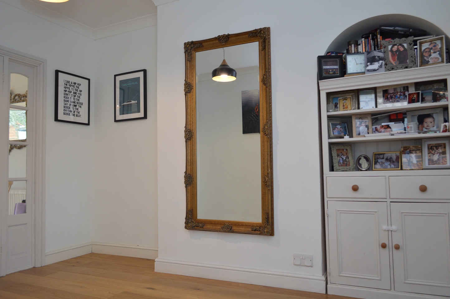 Large ornate gold portrait mirror