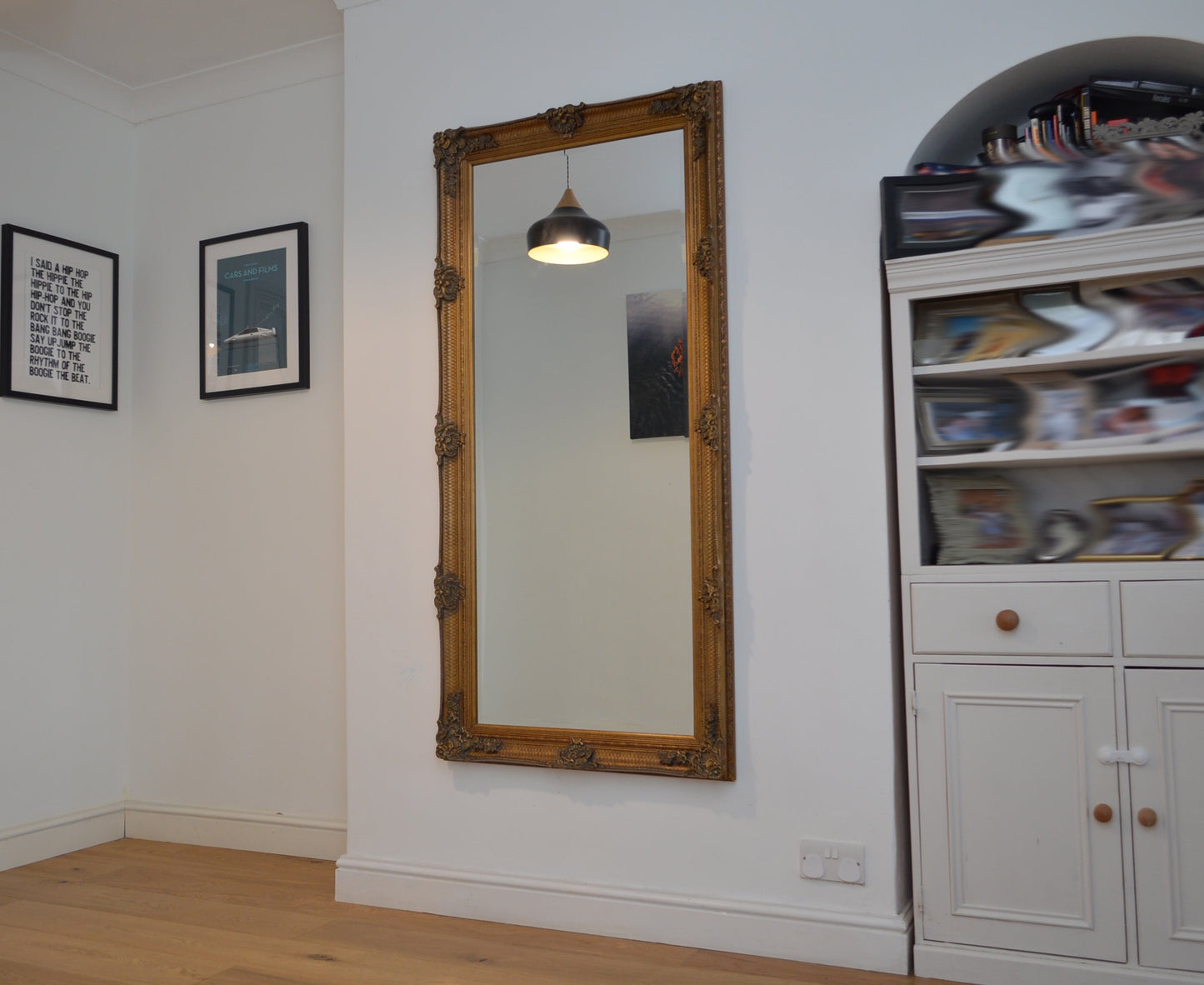 Large ornate gold portrait mirror