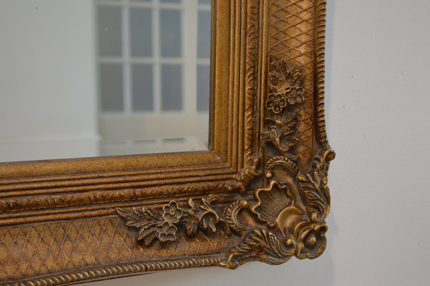 Large ornate gold portrait mirror