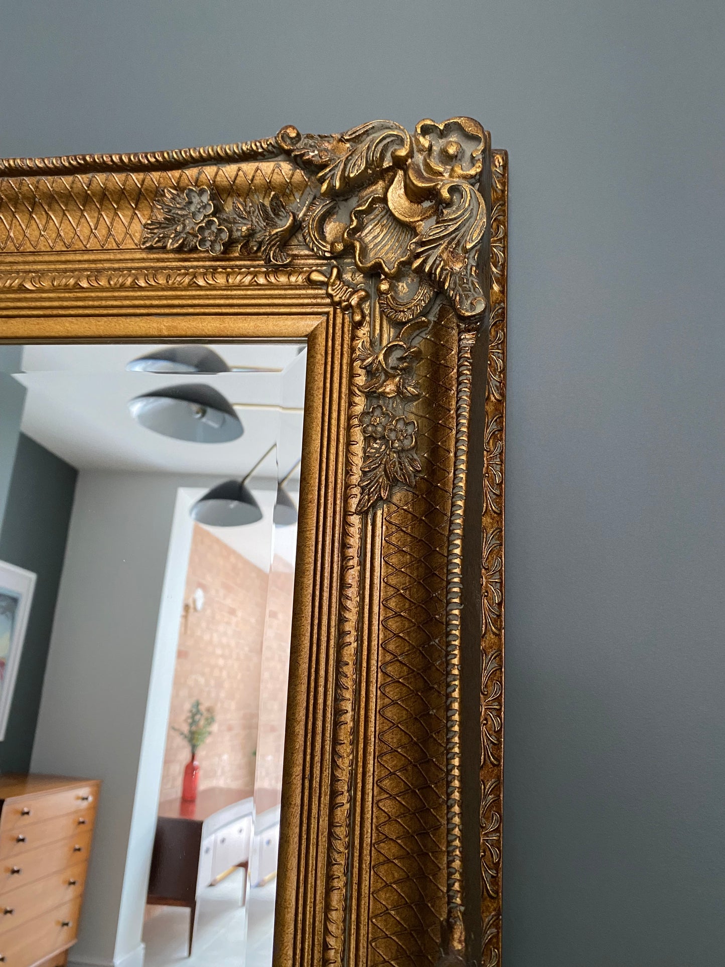 Large ornate gold portrait mirror